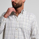 Close-up of a man wearing a white check shirt, showing the button-down collar, fine grid pattern and upper-body fit.