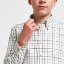 Close-up of a boys’ cream checked shirt showing the button-down collar, check pattern and button fastening.