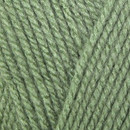 Close-up of tightly twisted gren yarn strands arranged diagonally, showing the texture and weave of the wool.