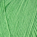 Close-up of tightly twisted green yarn strands arranged diagonally, showing the texture and weave of the wool.
