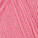 Close-up of tightly twisted pink yarn strands arranged diagonally, showing the texture and weave of the wool.