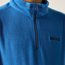Blue fleece jacket shown from the back, featuring long sleeves and a high collar. The fabric appears soft and warm, conveying a cozy feel.