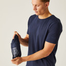 A man in a navy t-shirt holds a small, navy drawstring bag with white text. He looks at the bag, conveying curiosity. Neutral background.