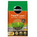 Bag of Miracle-Gro Thick'R Lawn seed and fertilizer on lush grass, set against dense green foliage. The packaging is red and green, emphasizing growth.