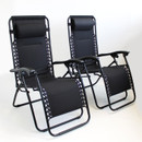 Two black reclining chairs with padded headrests, positioned side by side against a light background.