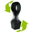 A black tire disintegrates into particles above a black container, with two green arrows forming a recycling symbol around them, suggesting sustainability.