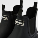 Close-up of black Barbour Chelsea wellington boot showing elastic side panel and embossed Barbour branding on the sole.