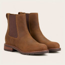 Pair of brown leather Chelsea boots with elastic side panels, pull tabs, contrast stitching and rugged soles.