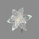 A translucent, shimmering white flower ornament with intricate glittery details on its petals, set against a plain gray background. Elegant and festive.