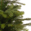 Close-up of realistic artificial Christmas tree branches featuring dense green pine needles for a natural festive appearance.