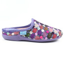 Side view of a Lunar women's mule slipper with a soft purple sole and trim. The upper features a textured knit design with multicoloured circular dot patterns in shades of pink, purple, red, green, and white. A small blue Lunar brand tag is stitched on the side.