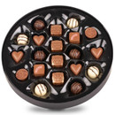 Close-up of Baileys Chocolate Collection tin showing an assortment of heart, truffle and square-shaped chocolates.