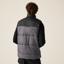 Back view of padded grey and black work vest featuring horizontal quilting, durable fabric, and small circular logo on upper back