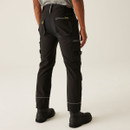 Rear view of black utility work pants with elastic waistband, zip back pocket, cargo storage compartments, and reinforced stitching for durability and flexibility.