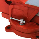 A red swivel base cast iron vice on a white background.