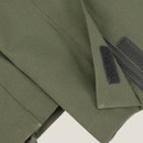 Close-up of the adjustable ankle fastening on Green King II waterproof trousers in green.