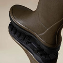 Close-up of the textured rubber upper and chunky treaded sole on Le Chameau women’s green Giverny wellington boots.