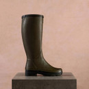 Side profile of a Le Chameau women’s Giverny green wellington boot with tall rubber upper and rugged black sole.