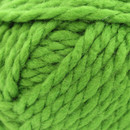 Close-up of green super chunky yarn, showing thick, softly twisted strands and a plush texture.