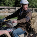 A view of a man wearing a Betacraft bush shirt sat on a quad bike