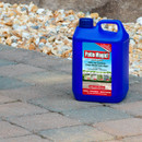 Blue container of Patio Magic! cleaner on a paved surface with gravel background. Label claims to kill and control green mould and algae.