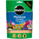 Packaging of Miracle-Gro Moisture Control Water Storing Gel features vibrant flowers at the bottom, emphasising gardening. It promotes reduced watering.