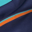 Detail of the 600 denier ripstop outer fabric on the Tempest Original turnout rug with orange and teal trim.