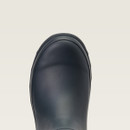 Close-up of the top view of a sleek, dark navy rubber boot against a light beige background. The boot's surface is smooth and slightly shiny.