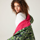 A view of the green camo print contrasting against the pink cosy lining.