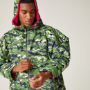 A man wearing a green camo print robe with the hood up.