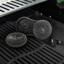 Scour brush shown with removable wire scrub pads and fixing parts on the barbecue grill surface.