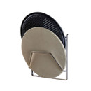 Round pizza stone and ribbed griddle plate stored upright in a metal holder on a white background.