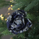 A view of a dark blue rose clip on decoration embellished with shiny silver beads on a Christmas tree