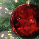 Close up of Red Shatterproof Bauble on a Christmas tree