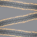 Warm white cluster Christmas tree lights with densely packed LEDs on a green cable, creating a bright and elegant festive display for indoor and outdoor use.