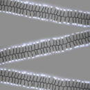 White LED cluster Christmas lights arranged in long strands on a green cable, providing a bright cool white glow for indoor and outdoor festive displays.