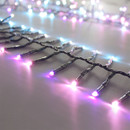 Close-up of pastel-coloured LED cluster lights featuring pink, blue and cool white bulbs on a green wire Christmas light string.