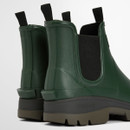 Rear three-quarter view of green Barbour Chelsea wellies showing heel structure, pull tabs and rugged outsole.