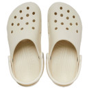 Top-down view of bone-coloured Crocs Classic Clogs displaying ventilation holes and contoured footbed.