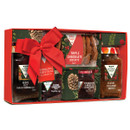 Festive gift box with a red ribbon, containing Bucks Fizz marmalade, cranberry sauce, strawberry jam, chutney, and chocolate biscuits. Holiday-themed packaging.