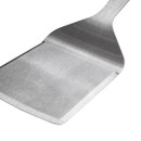 Close-up of the brushed stainless steel turner blade, highlighting the wide lifting surface and reinforced angled design.