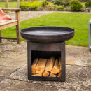 Metal fire bowl with a built-in log storage compartment beneath, placed on a paved patio.