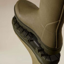 Close-up of the rugged treaded outsole and rubber upper on a Le Chameau women’s olive green wellington boot.