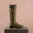 Side profile of a Le Chameau women’s olive green tall wellington boot with adjustable gusset and rugged treaded sole.
