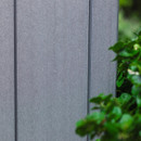 Close-up of the grey wood-effect panel texture on the garden storage box.