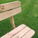 Close-up of the wooden slatted seat and backrest on a garden bench.