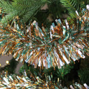 A a close up view of a tricoloured tinsel on a Christmas tree