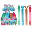 Display of Christmas bubble tubes featuring festive-shaped wands including Christmas tree, snowflake, reindeer antlers and Santa hat designs, shown with retail display packaging on a light grey background.