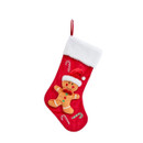 Red Christmas stocking with a white fur top, featuring a gingerbread man and candy cane designs. Festive and cheerful holiday decoration.