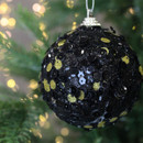 Close up of Black and Gold Sequinned Bauble on a Christmas tree